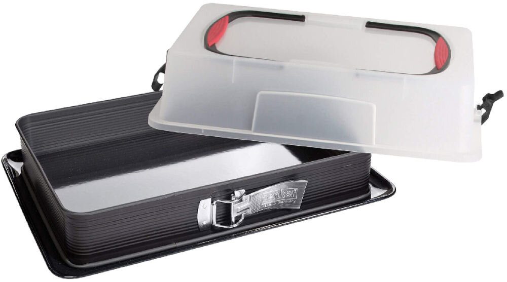 Na zdjęciu znajduje się prostokątna forma do pieczenia z metalowym zamknięciem i przezroczystą pokrywą z uchwytami. Na zamknięciu widoczny jest napis \'zenker\'.