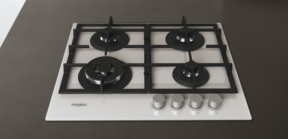 Biała płyta gazowa z czterema palnikami i żeliwnymi rusztami. Widoczne logo: Whirlpool.