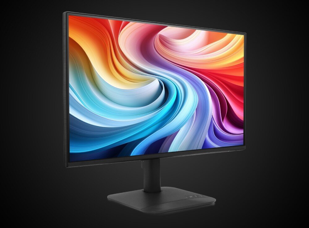 Monitor ACER KA242YP6BIP Monitor komputerowy z wyświetloną na ekranie grafiką przedstawiającą zakręcone wstęgi o wielu barwach na czarnym tle