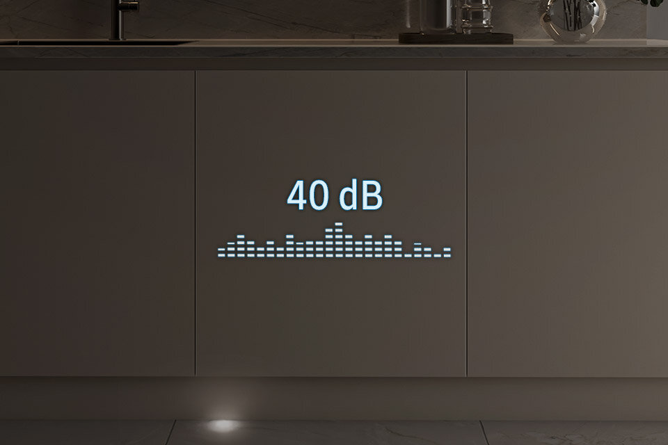 ciche działanie Na obrazie widoczny jest front zmywarki z wyświetlonym napisem \'40 dB\' oraz graficznym wskaźnikiem poziomu dźwięku.