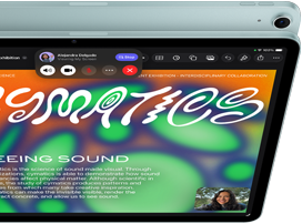 Tablet z wyświetlaczem pokazującym kolorową grafikę z napisem \'CYMATICS\' oraz tekstem \'SEEING SOUND\'. Na ekranie widoczne są także ikony aplikacji i małe okno rozmowy wideo.