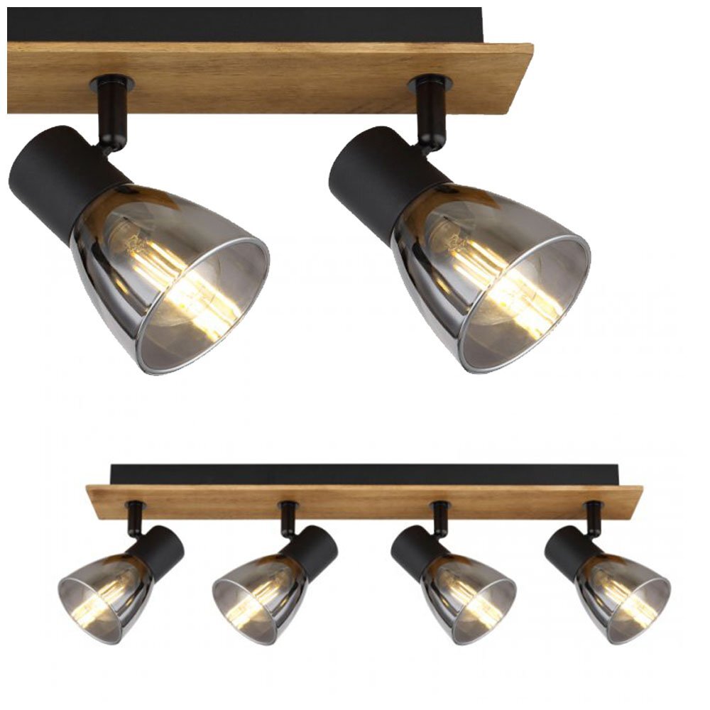 Lampa sufitowa z czterema reflektorami, wykonana z drewna w kolorze brązowym i czarnego matowego metalu, z przydymionymi szklanymi kloszami. Reflektory są zamontowane na prostokątnej listwie.