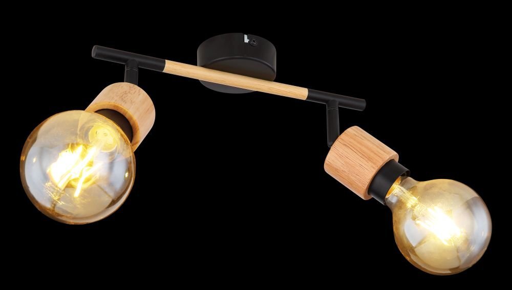 Lampa ścienna z dwoma żarówkami w oprawach z czarnego matowego metalu i drewna, zamontowana na czarnym uchwycie z drewnianym elementem. Żarówki są włączone, emitując ciepłe światło.
