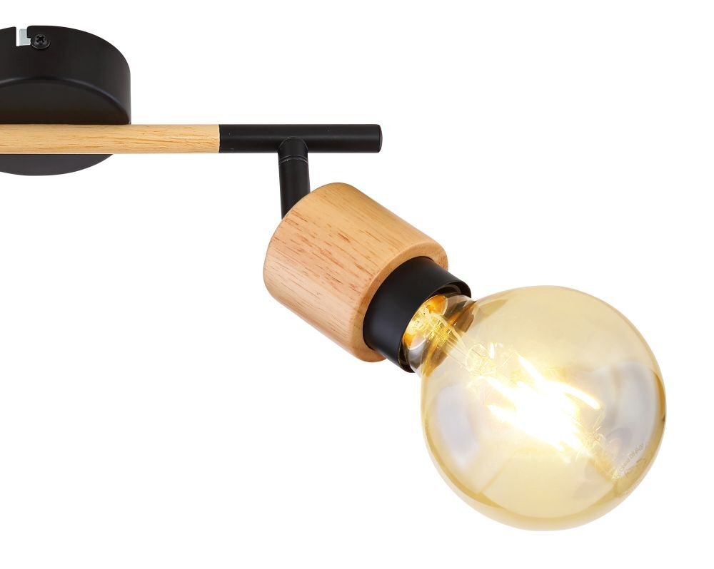 Lampa ścienna z czarnym matowym uchwytem i drewnianym elementem, wyposażona w dużą żarówkę. Konstrukcja umożliwia regulację reflektora.