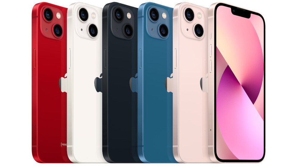 Na obrazie widoczne są smartfony w różnych kolorach: czerwonym, białym, czarnym, niebieskim i różowym. Każdy z nich ma dwa aparaty z tyłu i wyświetlacz z wcięciem na górze.