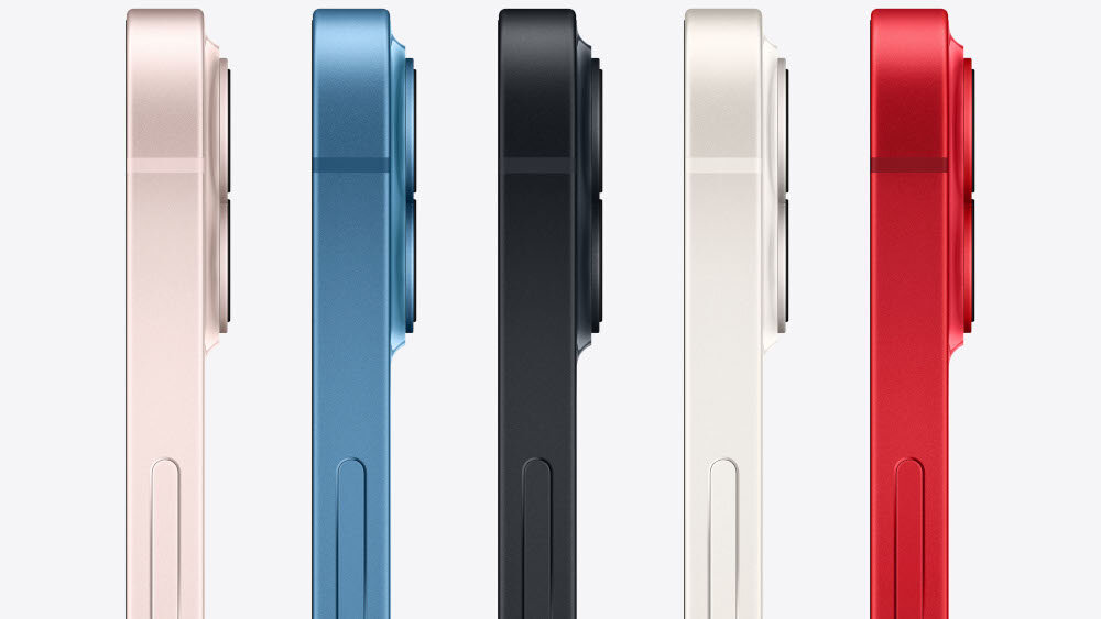 Pięć smartfonów ustawionych bokiem, każdy w innym kolorze: różowy, niebieski, czarny, biały i czerwony. Widoczne są wystające obiektywy aparatów.