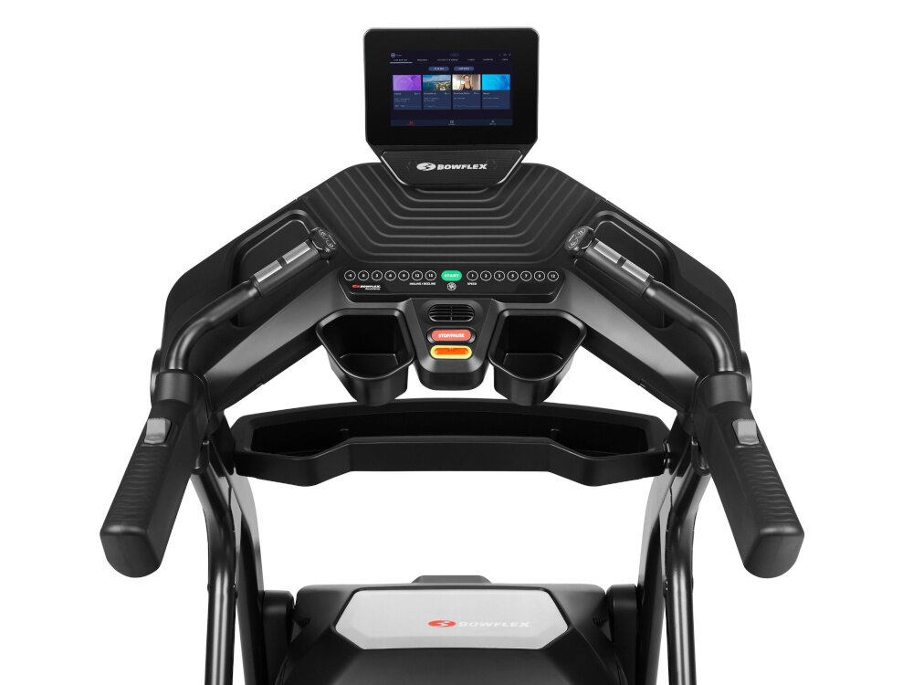 Na obrazie widoczna jest konsola bieżni elektrycznej z ekranem dotykowym i przyciskami sterującymi. Logo \'BOWFLEX\' znajduje się poniżej ekranu.