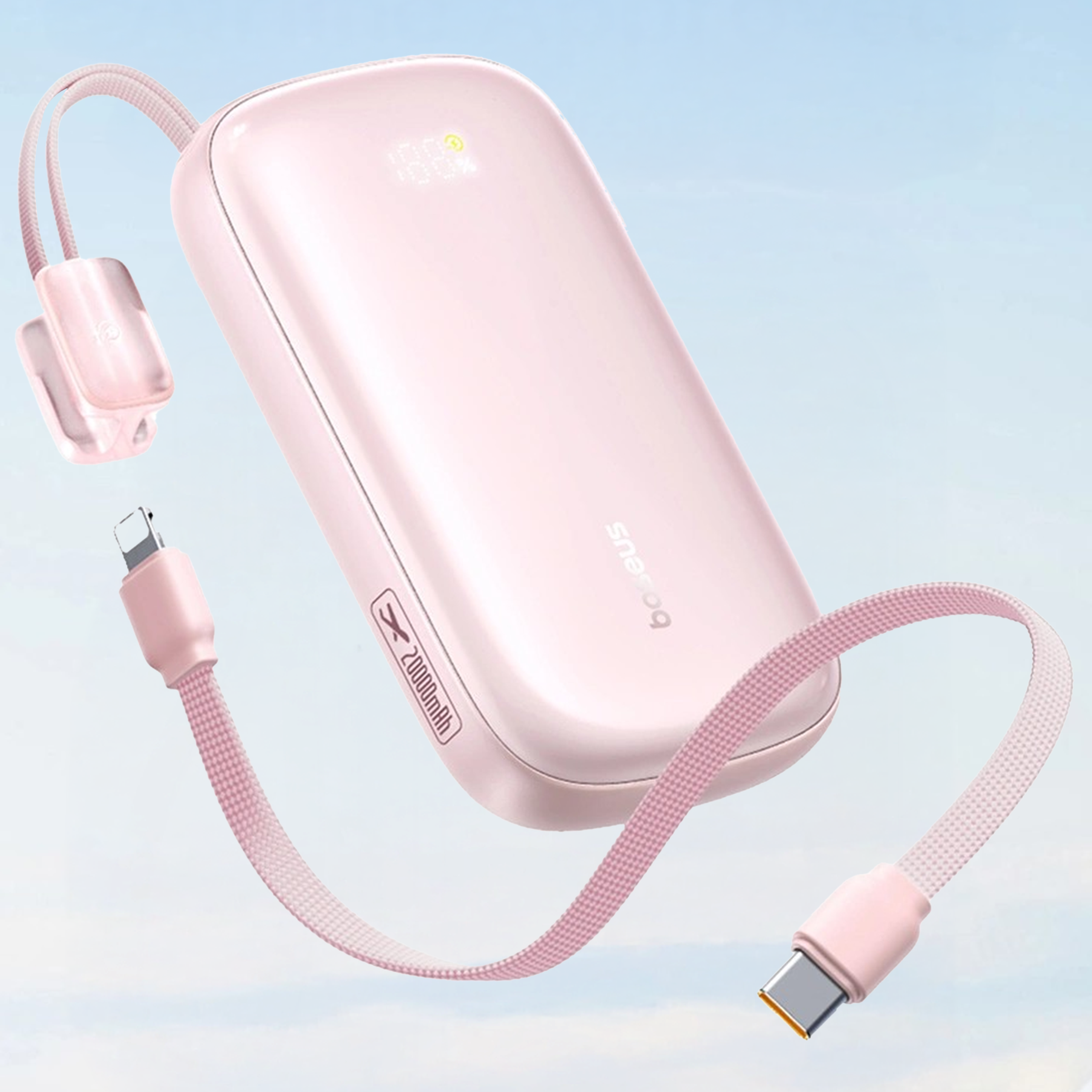 Różowy power bank z logo \'Baseus\' i napisem \'20000mAh\' na obudowie, wyposażony w kabel 2w1 z końcówkami USB-C i Lightning. Tło jest jasnoniebieskie, przypominające niebo.