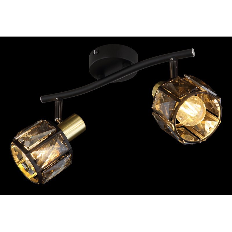Lampa sufitowa z dwoma reflektorami, wykonana z czarnego matowego metalu i złotych elementów, z przydymionymi szklanymi kryształami. Reflektory są zamontowane na zakrzywionej belce przymocowanej do okrągłej podstawy.