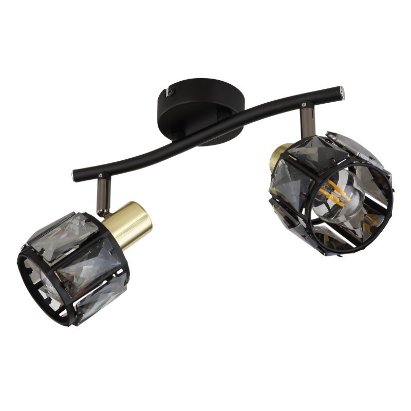 Lampa sufitowa z dwoma reflektorami, wykonana z czarnego matowego metalu i złotych elementów, z przydymionymi szklanymi kryształami. Reflektory są zamontowane na zakrzywionej belce.