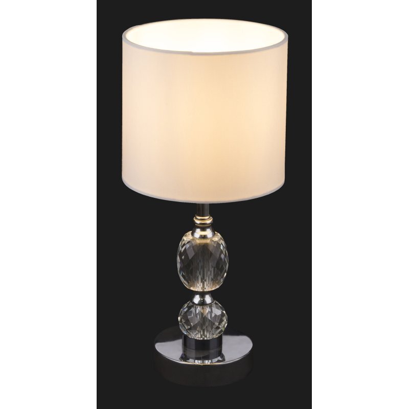 Lampa stołowa z białym abażurem i podstawą z chromowanego metalu oraz kryształowego szkła. Lampa posiada wyłącznik i jest przeznaczona na żarówkę E14 o mocy 40W.