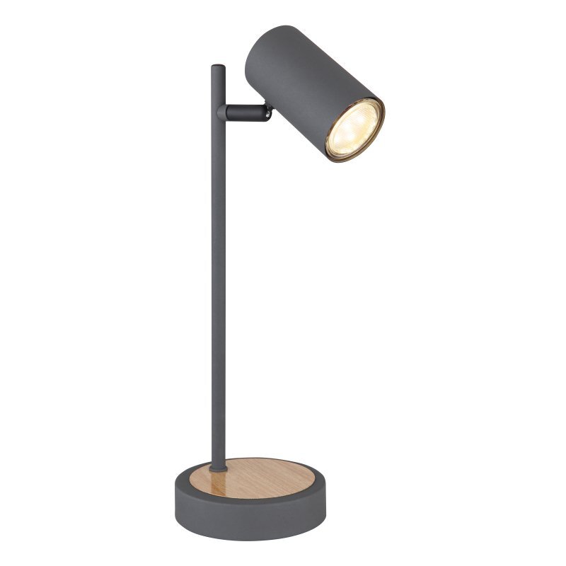Metalowa lampa stołowa w kolorze grafitowym z drewnianą podstawą i cylindrycznym kloszem. Lampa jest włączona, emitując ciepłe światło.