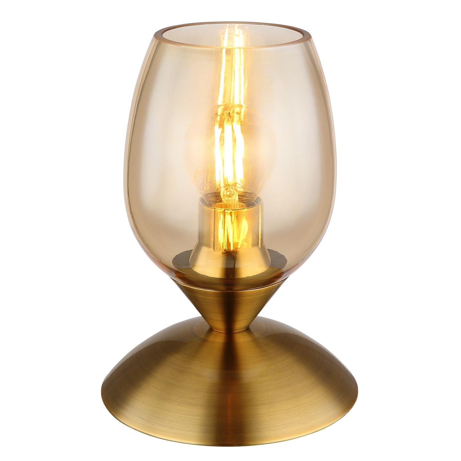 Lampa stołowa z przezroczystym kloszem w kształcie kielicha i metalową podstawą w kolorze złotym. Wewnątrz klosza znajduje się żarówka emitująca ciepłe światło.