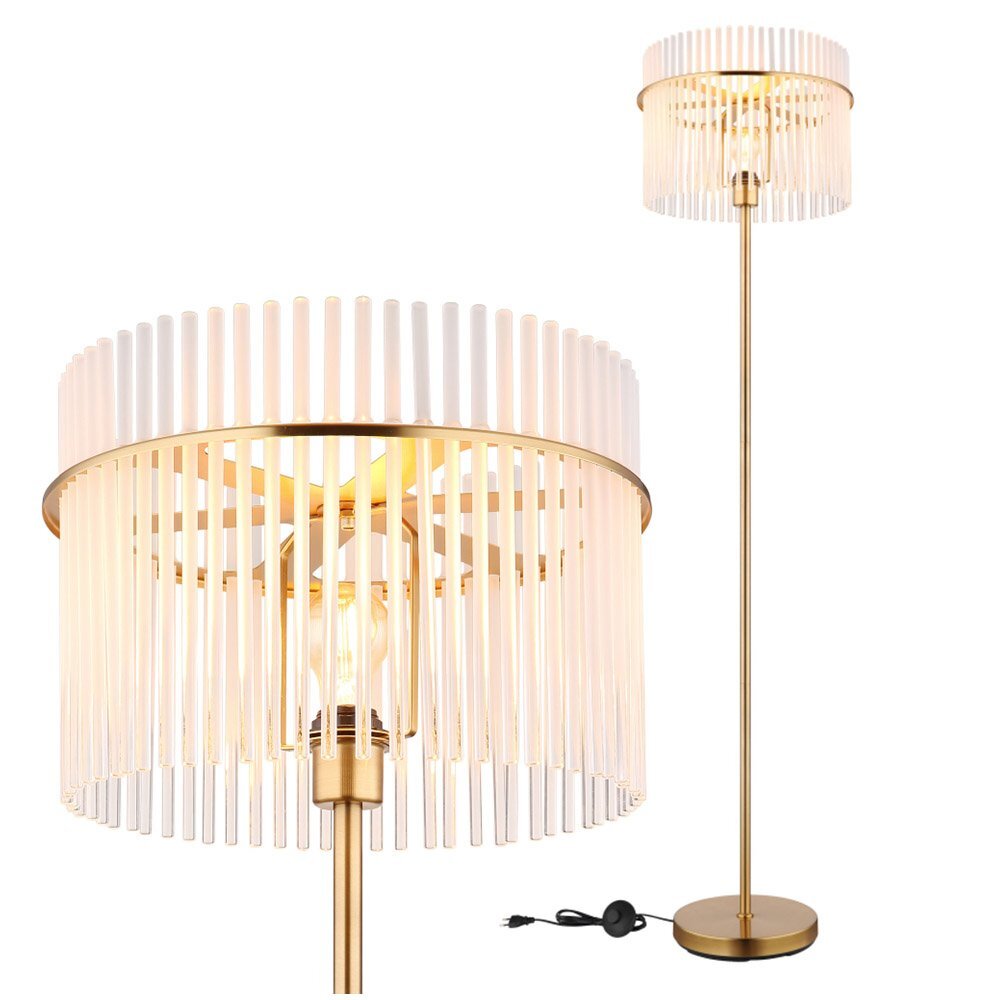 Lampa podłogowa z metalowym stelażem i kloszem z pionowych prętów, w kolorze złotym. Widoczny jest przewód z włącznikiem.