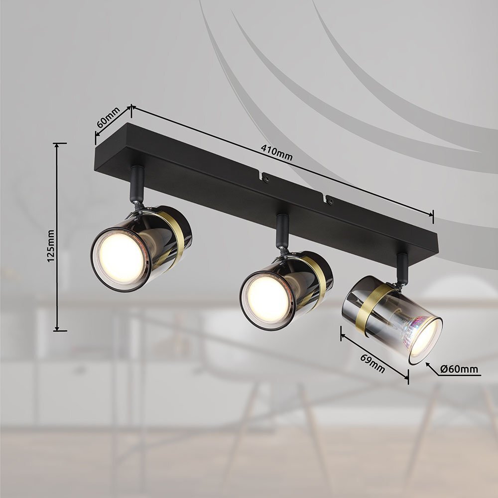 Na obrazie widoczna jest czarna matowa lampa sufitowa z trzema reflektorami, wykonana z przydymionego szkła i mosiądzu. Wymiary to 410 mm długości, 125 mm wysokości, 60 mm średnicy reflektorów i 69 mm głębokości.