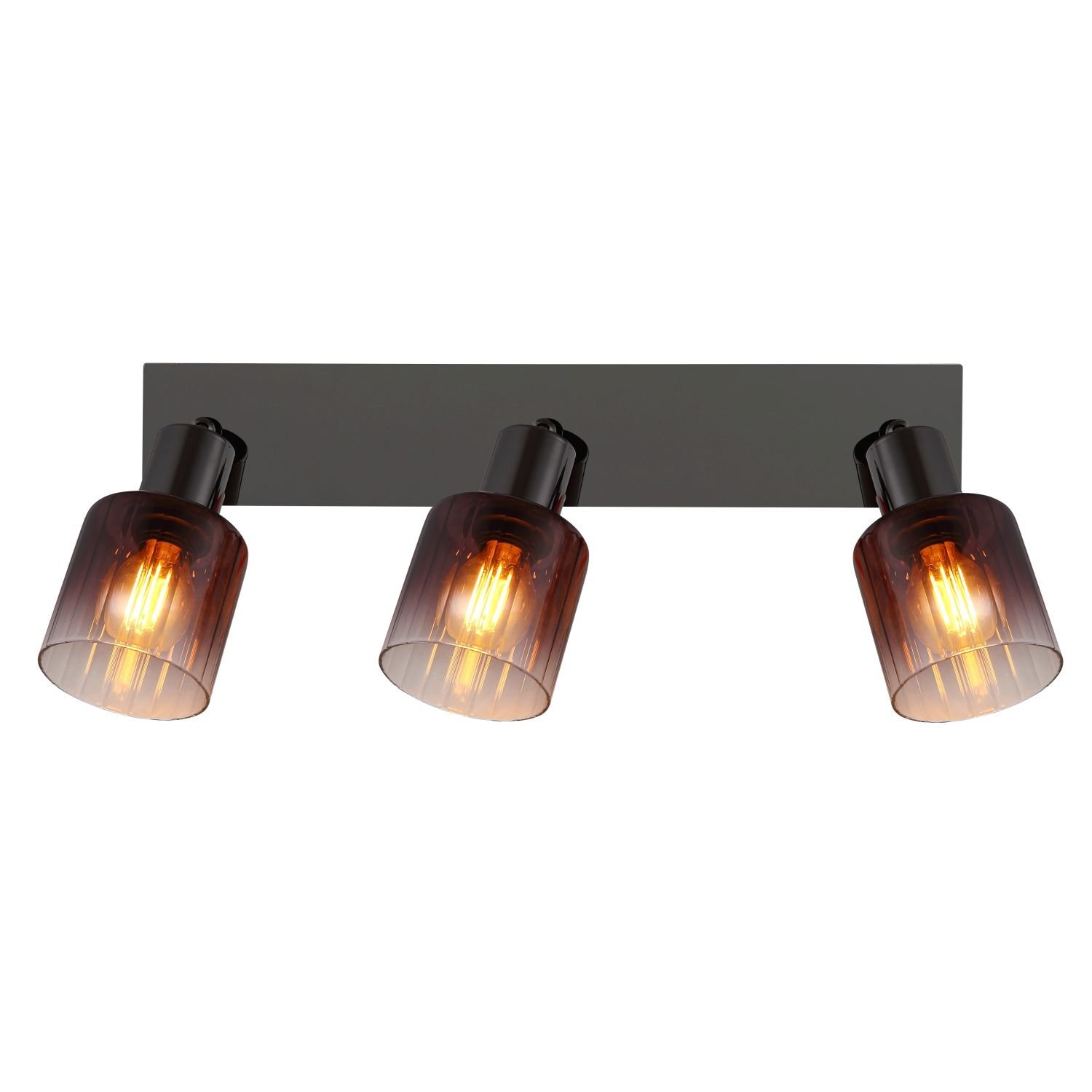Na obrazie widoczna jest lampa z trzema reflektorami, każdy z przezroczystym kloszem i widoczną żarówką wewnątrz. Reflektory są zamontowane na prostokątnej, ciemnej podstawie.