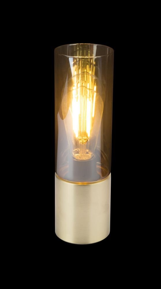 Lampa stołowa z cylindrycznym bursztynowym kloszem i złotą podstawą. Wewnątrz klosza widoczna jest żarówka emitująca ciepłe światło.