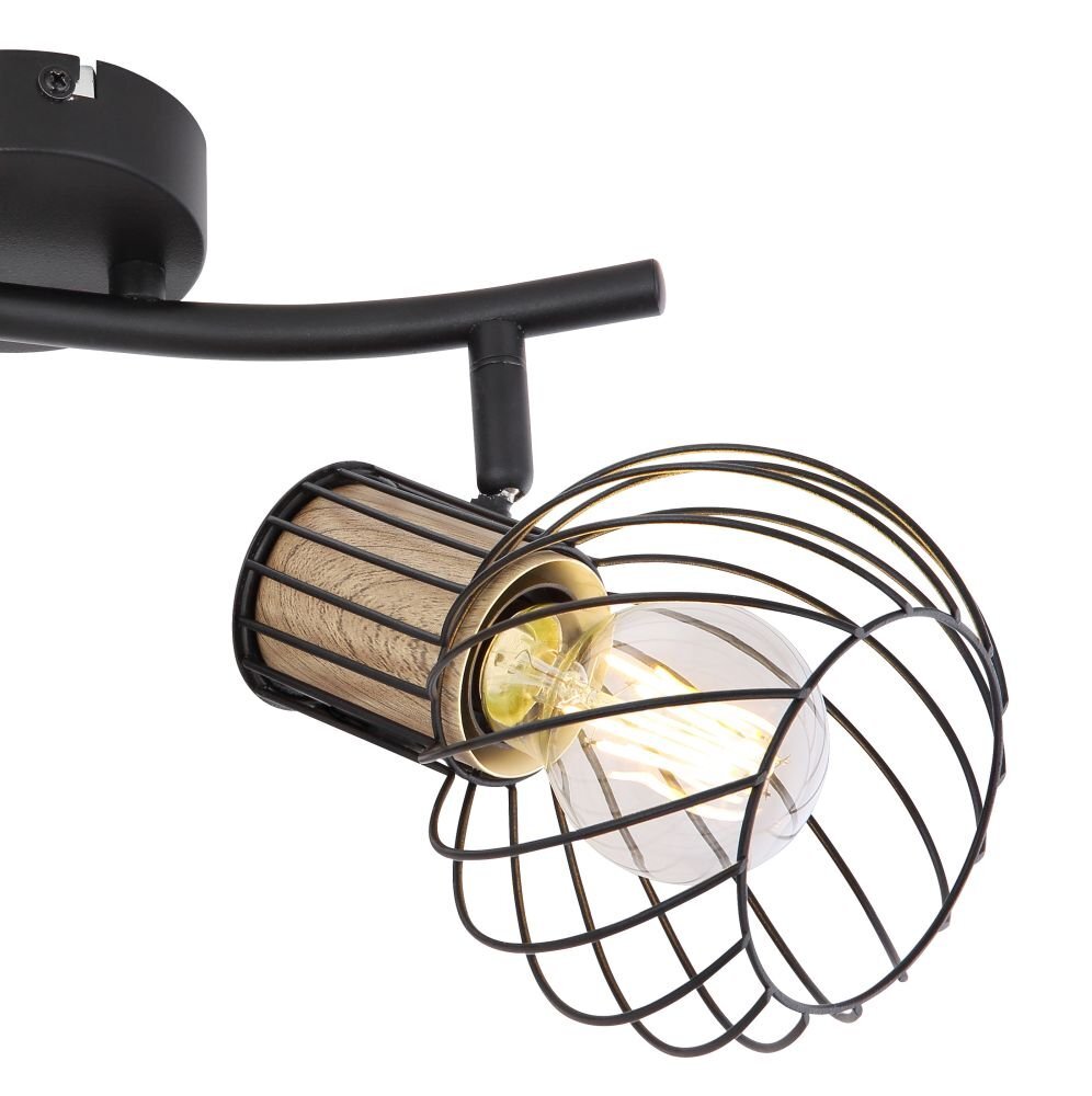 Lampa ścienna z czarnym metalowym uchwytem i brązowym drewnianym elementem, posiada regulowany reflektor z żarówką otoczoną metalową klatką.