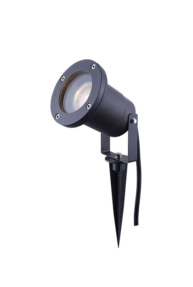Szara, aluminiowa lampa zewnętrzna typu spot z ruchomą głowicą, zamontowana na szpikulcu do gruntu. Lampa posiada okrągłą obudowę z widocznymi śrubami i długi kabel.