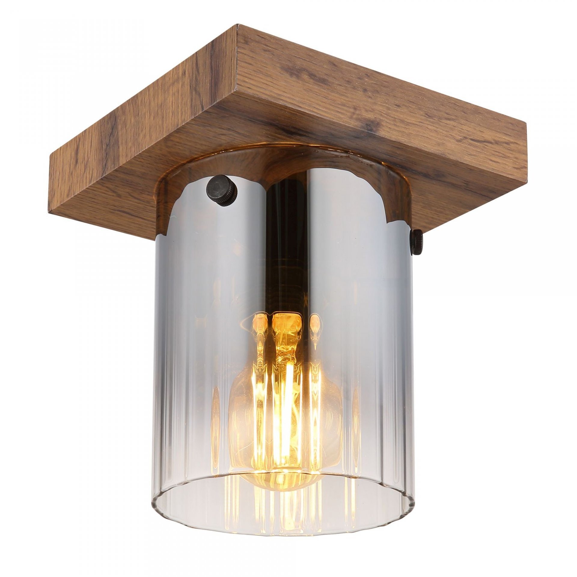 Lampa sufitowa z drewnianą podstawą i szklanym kloszem, wewnątrz którego znajduje się żarówka emitująca ciepłe światło.