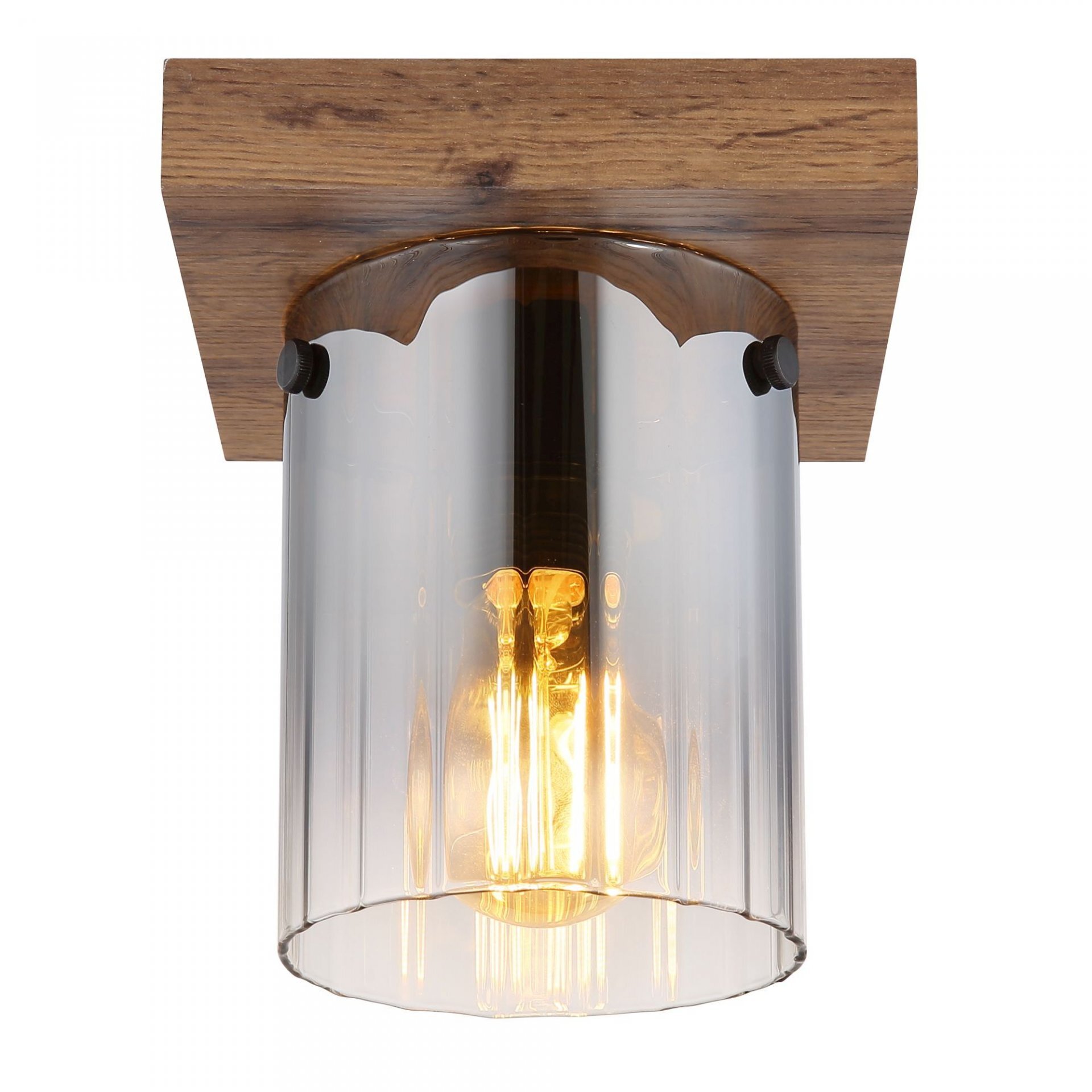 Lampa sufitowa z drewnianą podstawą i szklanym kloszem, przez który widać żarówkę emitującą ciepłe światło.
