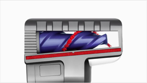 Obraz przedstawia końcówkę do odkurzacza z widocznym niebieskim wałkiem i czerwonymi elementami czyszczącymi. Końcówka ma szary korpus z prostokątnym wzorem na górze.
