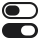 Ikona przedstawia dwa przełączniki, jeden w pozycji włączonej, a drugi wyłączonej. Oba przełączniki są w kolorze czarnym na białym tle.