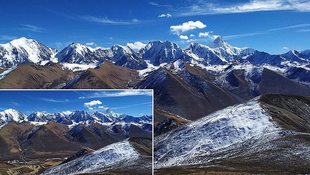 Panorama górska z ośnieżonymi szczytami pod błękitnym niebem. W lewym dolnym rogu znajduje się wstawka zbliżenia na fragment krajobrazu.