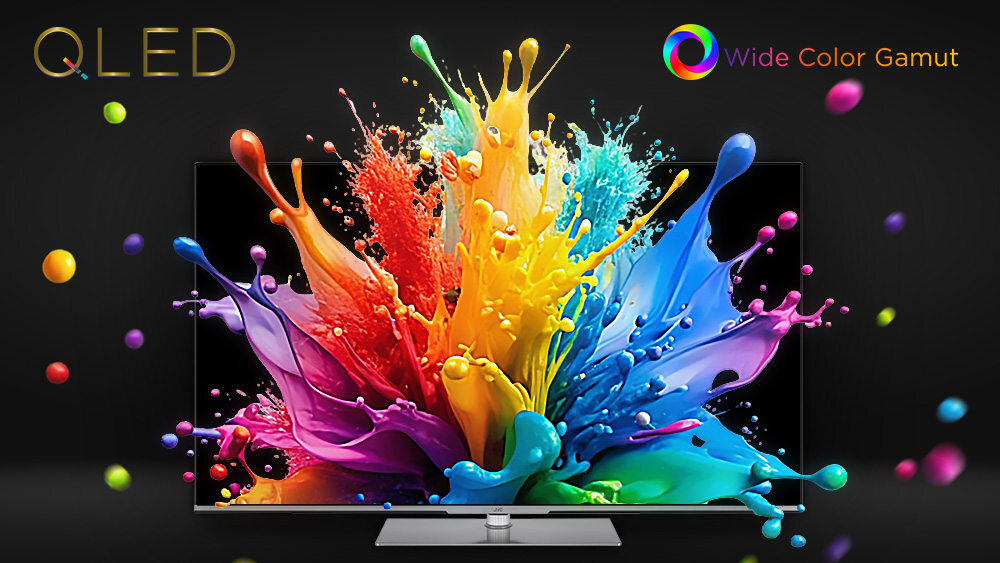 Telewizor z wyświetlaczem QLED pokazuje dynamiczną eksplozję kolorowych farb na czarnym tle. Widoczne są napisy \'QLED\' i \'Wide Color Gamut\'.