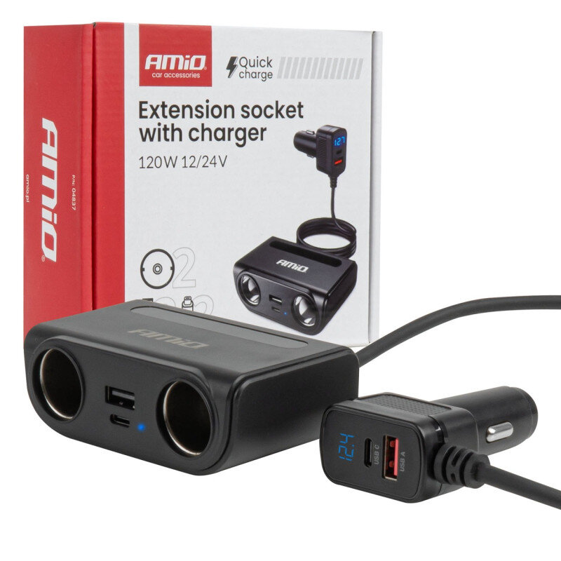 Na zdjęciu znajduje się czarny rozgałęziacz gniazda zapalniczki z dwoma portami USB, obok którego widoczne jest opakowanie z napisem \'AMiO car accessories Extension socket with charger 120W 12/24V\'.
