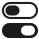 Ikona przedstawia dwa przełączniki, jeden w pozycji włączonej, a drugi wyłączonej, w kolorze czarnym na przezroczystym tle.