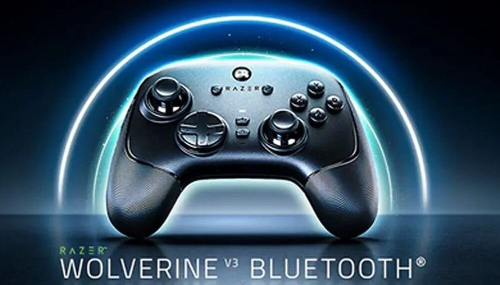 Na obrazie widoczny jest czarny kontroler do gier z logo Razer, otoczony świetlistym okręgiem. Na dole znajduje się tekst: \'RAZER WOLVERINE V3 BLUETOOTH\'.