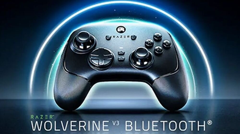 Na obrazie widoczny jest czarny kontroler do gier z logo Razer, umieszczony na tle z efektem świetlnym. Na dole znajduje się tekst: \'RAZER WOLVERINE V3 BLUETOOTH\'.