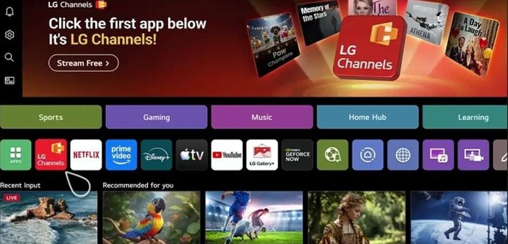 Interfejs telewizora z aplikacjami takimi jak LG Channels, Netflix, Prime Video, Disney+, Apple TV, YouTube. Na górze widoczny jest napis: \'Click the first app below It\'s LG Channels! Stream Free\'.