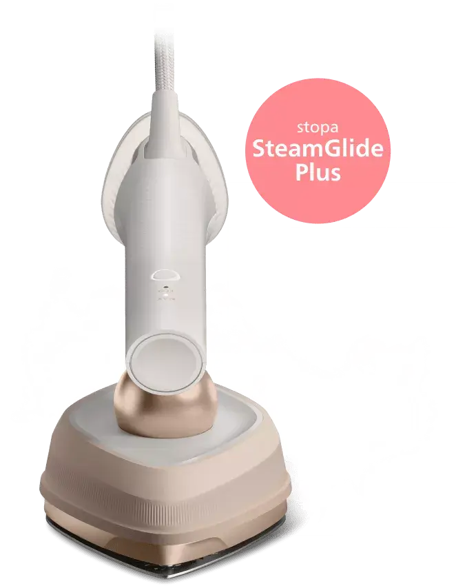 Na obrazie widoczna jest parownica do ubrań w kolorze beżowym z białymi elementami. Obok urządzenia znajduje się różowe koło z napisem \'stopa SteamGlide Plus\'.