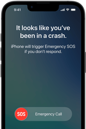 Ekran smartfona z komunikatem: \'It looks like you\'ve been in a crash. iPhone will trigger Emergency SOS if you don\'t respond.\' Widoczny przycisk \'SOS Emergency Call\'.