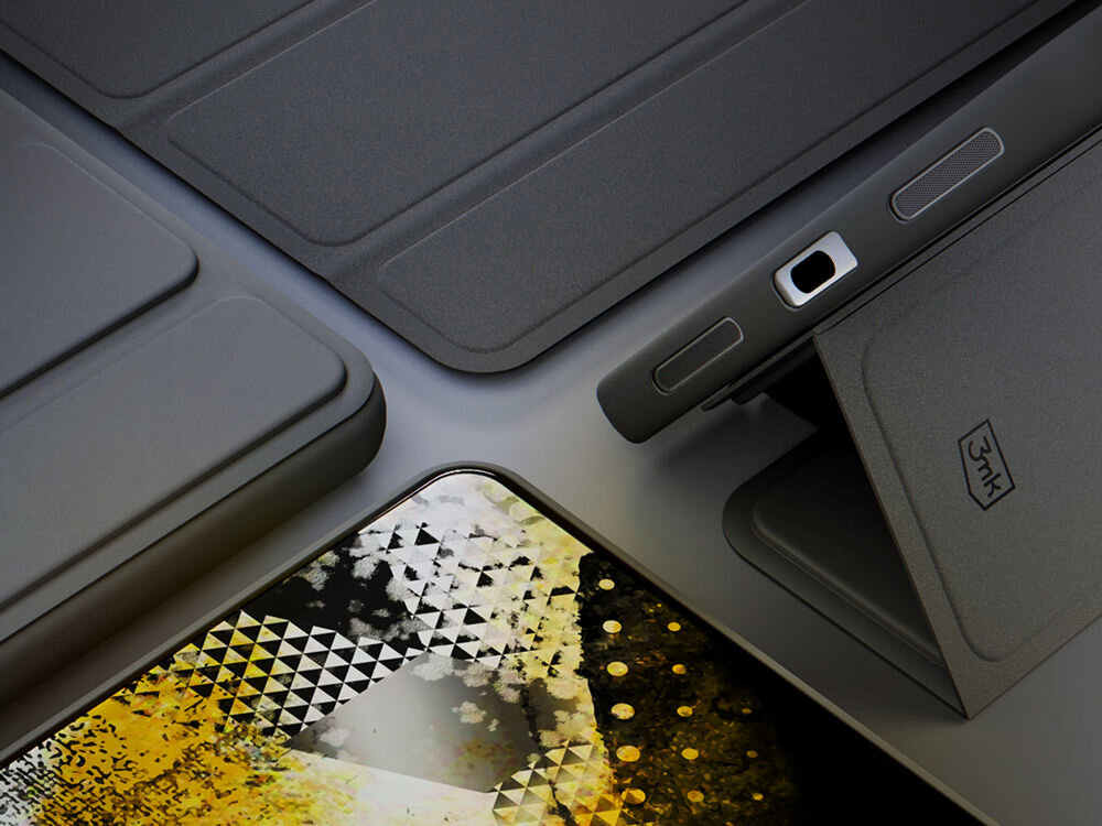 Obraz przedstawia czarne etui na tablet z widocznym logo \'3MK\'. Etui jest otwarte, a w tle widać fragment ekranu z abstrakcyjnym wzorem w kolorach czerni, bieli i żółci.