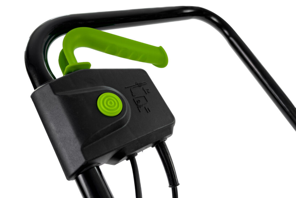 Czarna rączka z zielonym uchwytem i przyciskiem na obudowie z symbolami. Widoczne są również przewody wychodzące z obudowy.