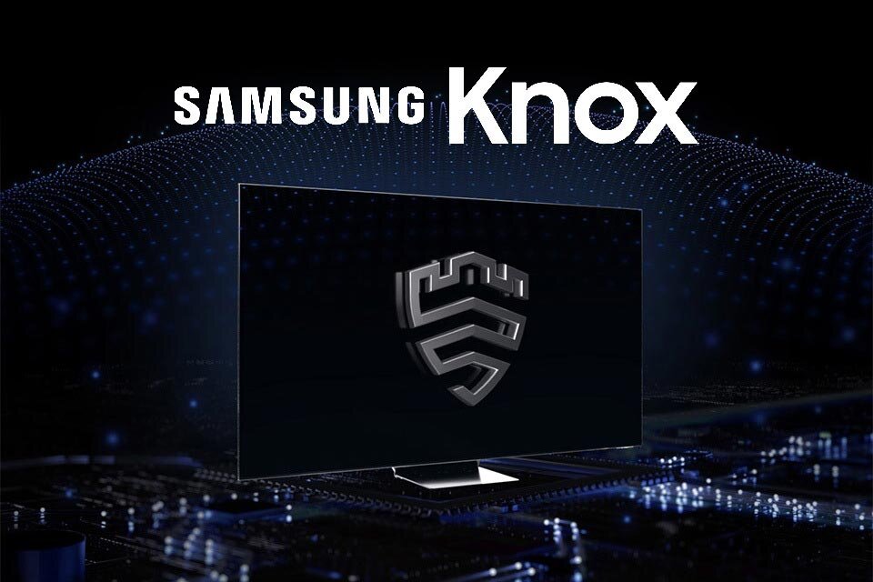 Na obrazie widoczny jest telewizor z logo w kształcie tarczy na ekranie, a w tle napis \'SAMSUNG Knox\'.