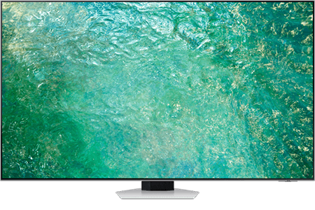 Telewizor z dużym ekranem wyświetlający obraz w odcieniach zieleni i błękitu. Urządzenie stoi na prostokątnej podstawie.