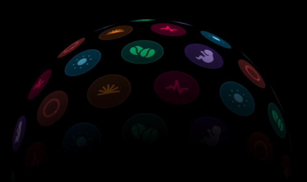 Obraz przedstawia ciemne tło z kolorowymi ikonami w kształcie okręgów, każda z różnym symbolem, jak serce czy fala. Ikony są rozmieszczone w półkolistym układzie.