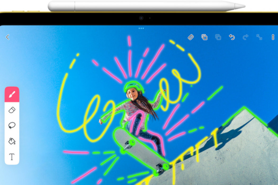 Na ekranie tabletu widać kolorowy rysunek osoby na deskorolce z neonowymi liniami. Na górze urządzenia znajduje się biały rysik.