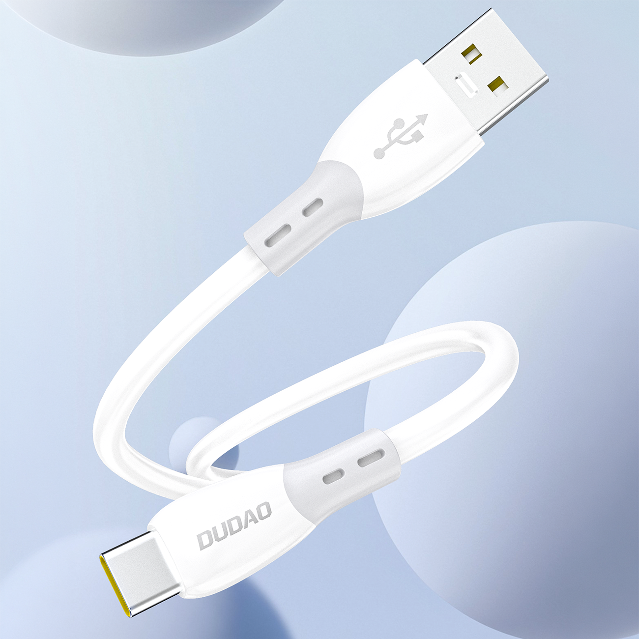 Biały kabel USB-A do USB-C z miękkim silikonowym oplotem, z widocznym logo \'DUDAO\' na jednym z końców. Tło jest jasnoniebieskie z okrągłymi kształtami.
