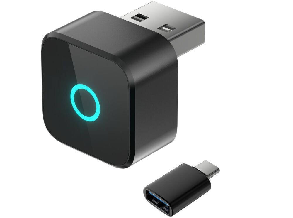 Na obrazie widoczny jest czarny adapter z portem USB i okrągłym, podświetlonym na niebiesko symbolem. Obok znajduje się mały adapter z końcówką USB-C.