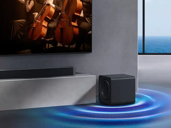 Soundbar Samsung HW-Q990H i subwoofer obok szafki RTV (Radio and Television) z niebieskimi kręgami dźwięku na podłodze.