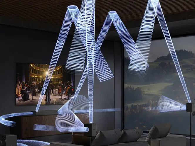 Soundbar Samsung HW-Q990H z tylnymi głośnikami i grafiką fal dźwiękowych w salonie.