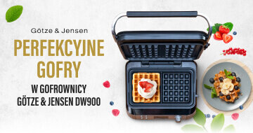 Gofrownica z otwartą pokrywą, obok talerz z gofrem udekorowanym owocami. Widoczny tekst: \'Götze & Jensen PERFEKCYJNE GOFRY W GOFROWNICY GÖTZE & JENSEN DW900\'.