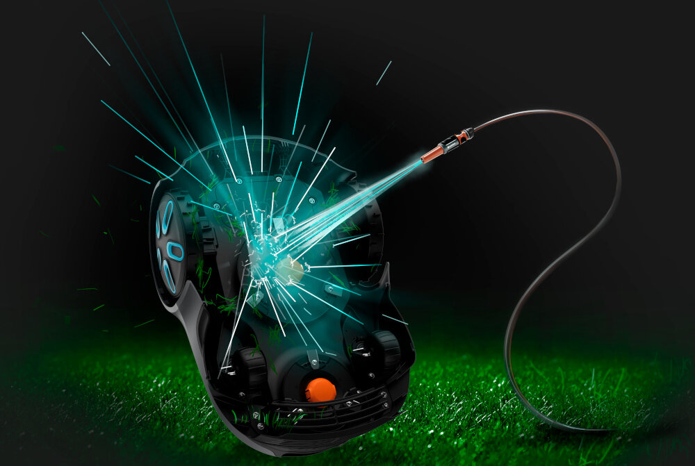 Obraz przedstawia robota koszącego na trawie, z którego wnętrza wydobywają się niebieskie promienie świetlne. Do robota podłączony jest przewód, z którego również emanuje światło.