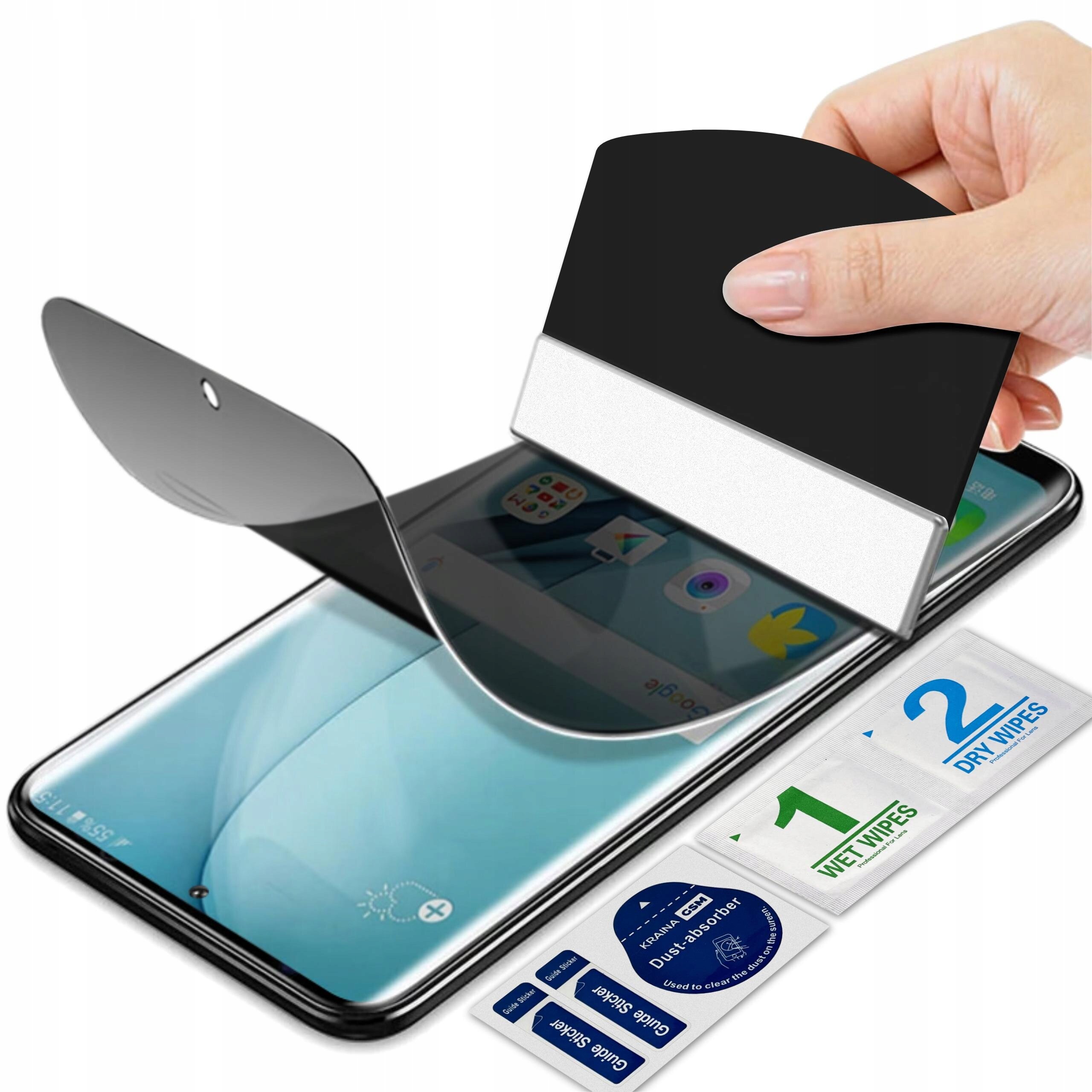 Na zdjęciu widoczna jest folia prywatyzująca do telefonu, która jest nakładana na ekran za pomocą narzędzia. Obok telefonu znajdują się opakowania z napisami \'1 WET WIPES\' i \'2 DRY WIPES\'.