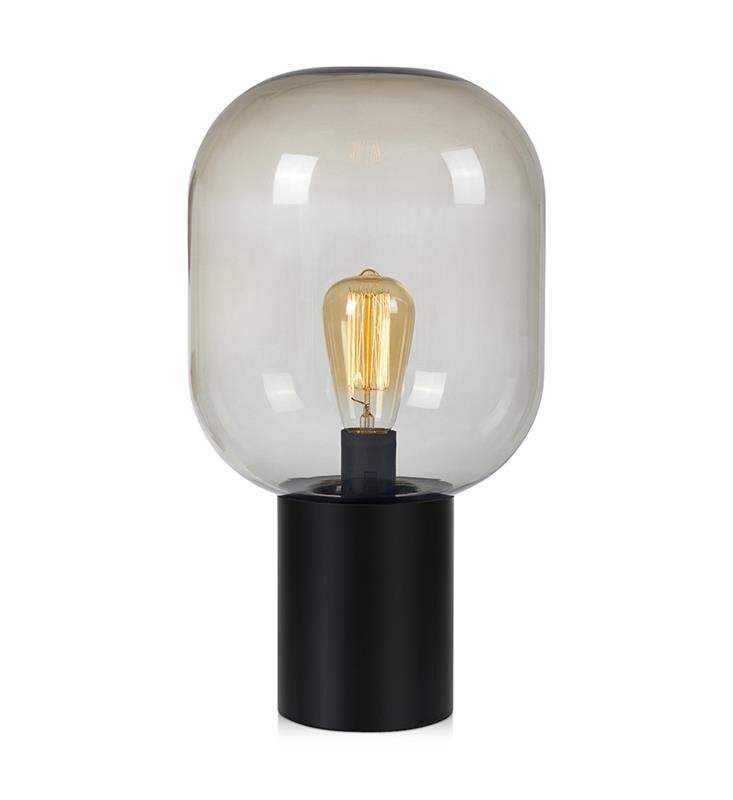 Lampa stołowa z przezroczystym kloszem w kształcie kopuły i czarną podstawą, wewnątrz której znajduje się żarówka w stylu vintage.